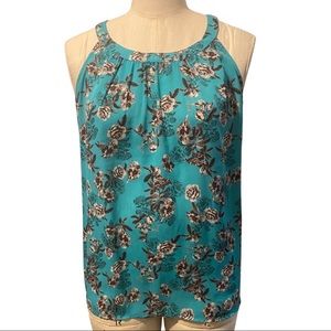 Torrid High-Lo Top with Black & White Floral Pattern on Teal Background